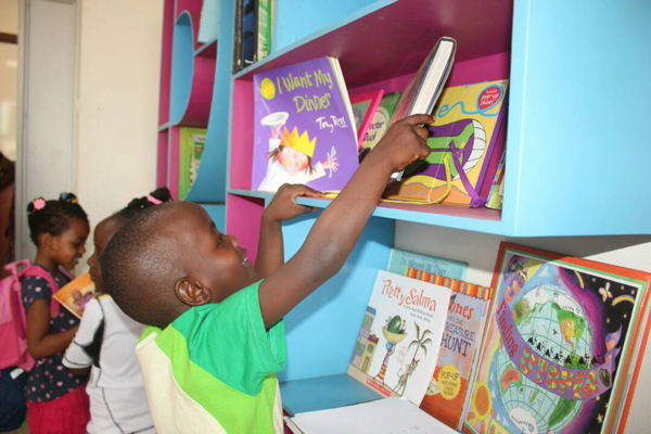 Little children selecting books at Read to Learn Foundation